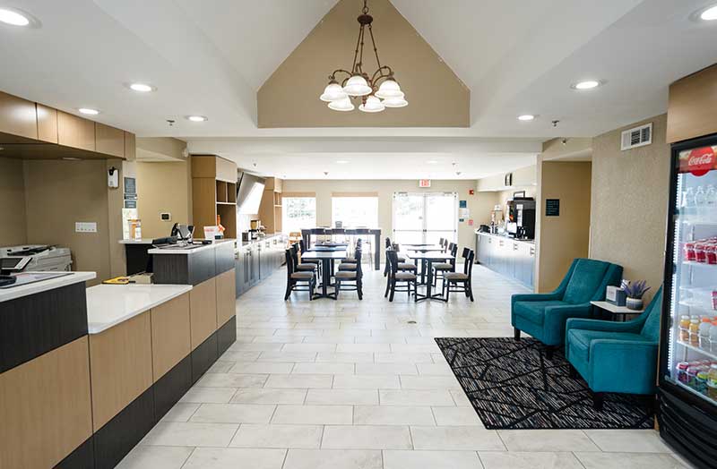 Friendly front desk staff welcoming guests at Mainstay Suites Knoxville Airport